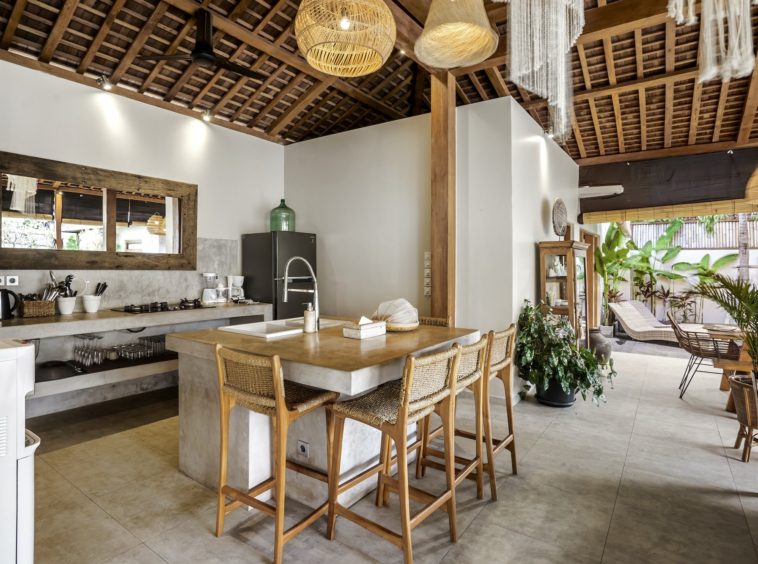 A fully equipped kitchen inside the semi-open living area