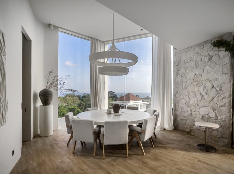 Dining table in the corner of a private villa in Bingin with ocean view in the distance