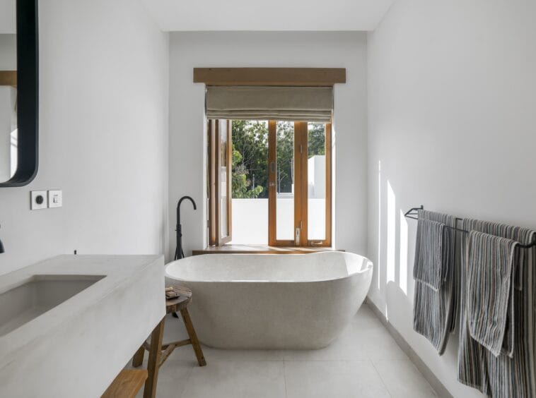 Bathtub by the window in an ensuite bathroom