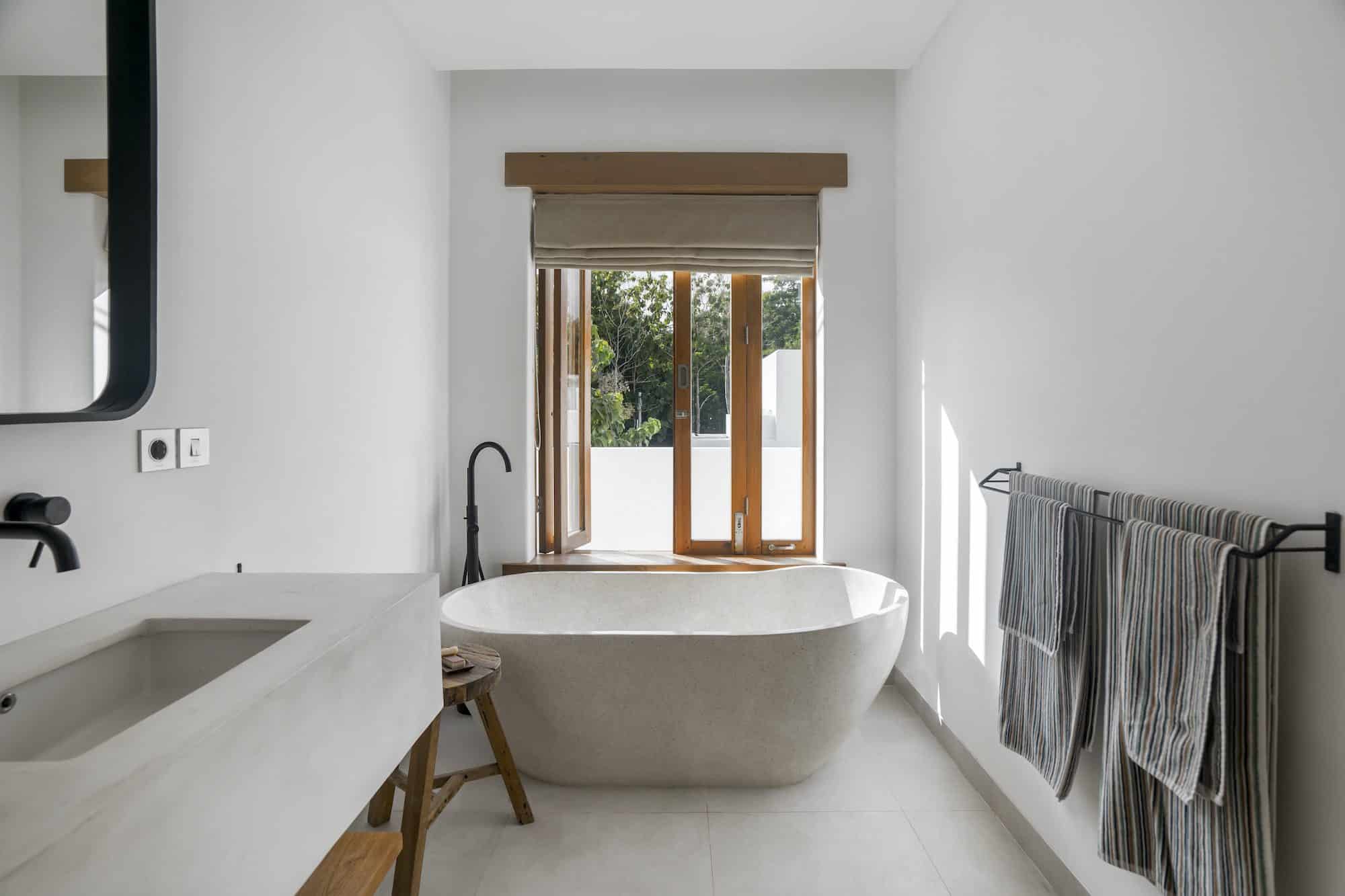 Bathtub by the window in an ensuite bathroom