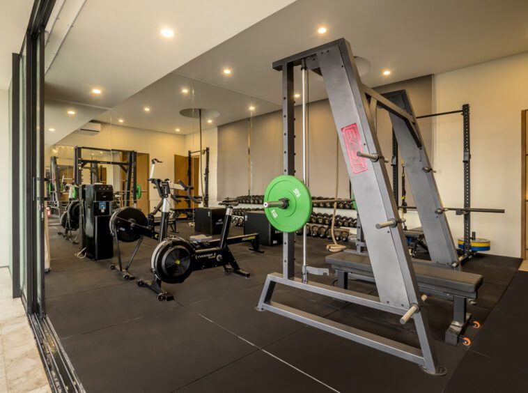 Private gym with weights and exercise machines at Uluwatu villa Kalani