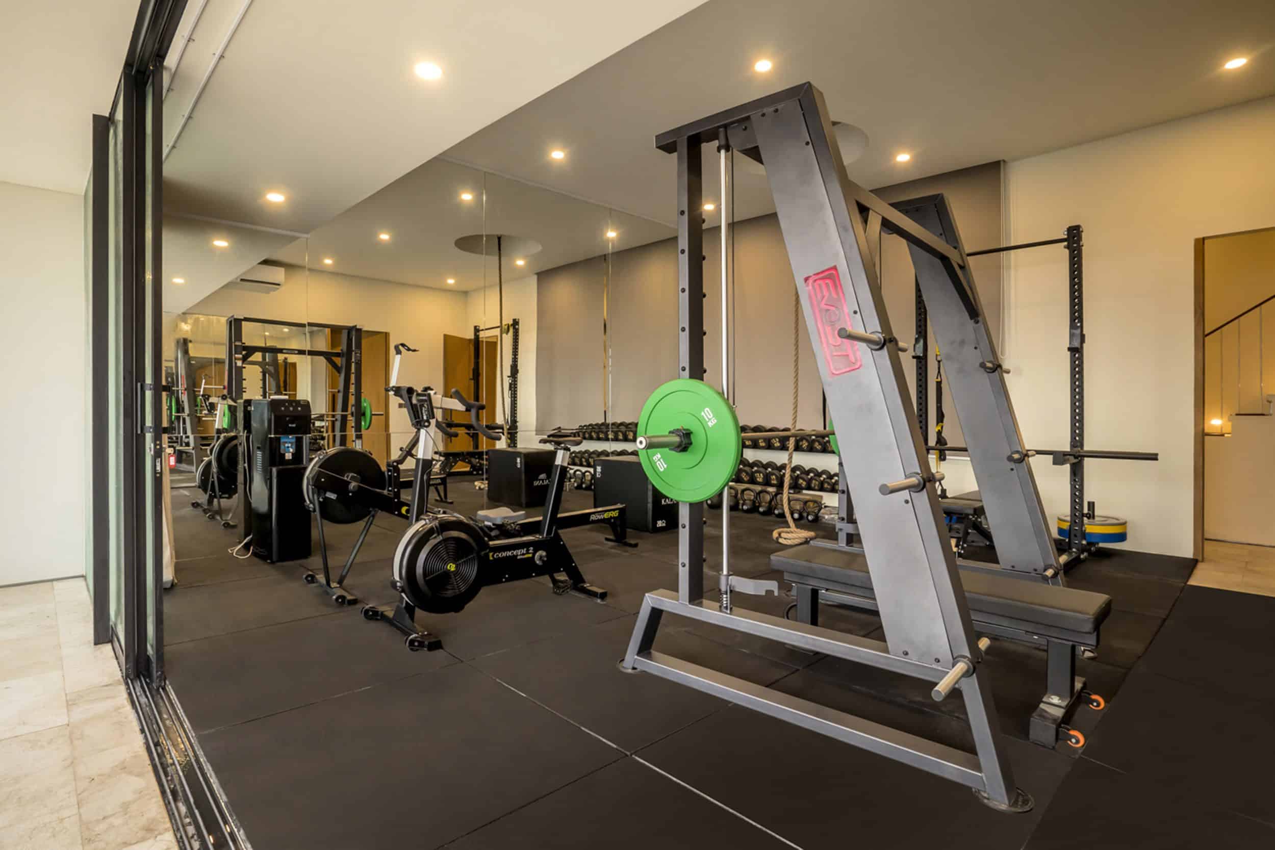 Private gym with weights and exercise machines at Uluwatu villa Kalani