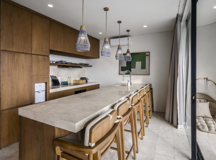 Fully equipped kitchen with kitchen island at a Uluwatu villa