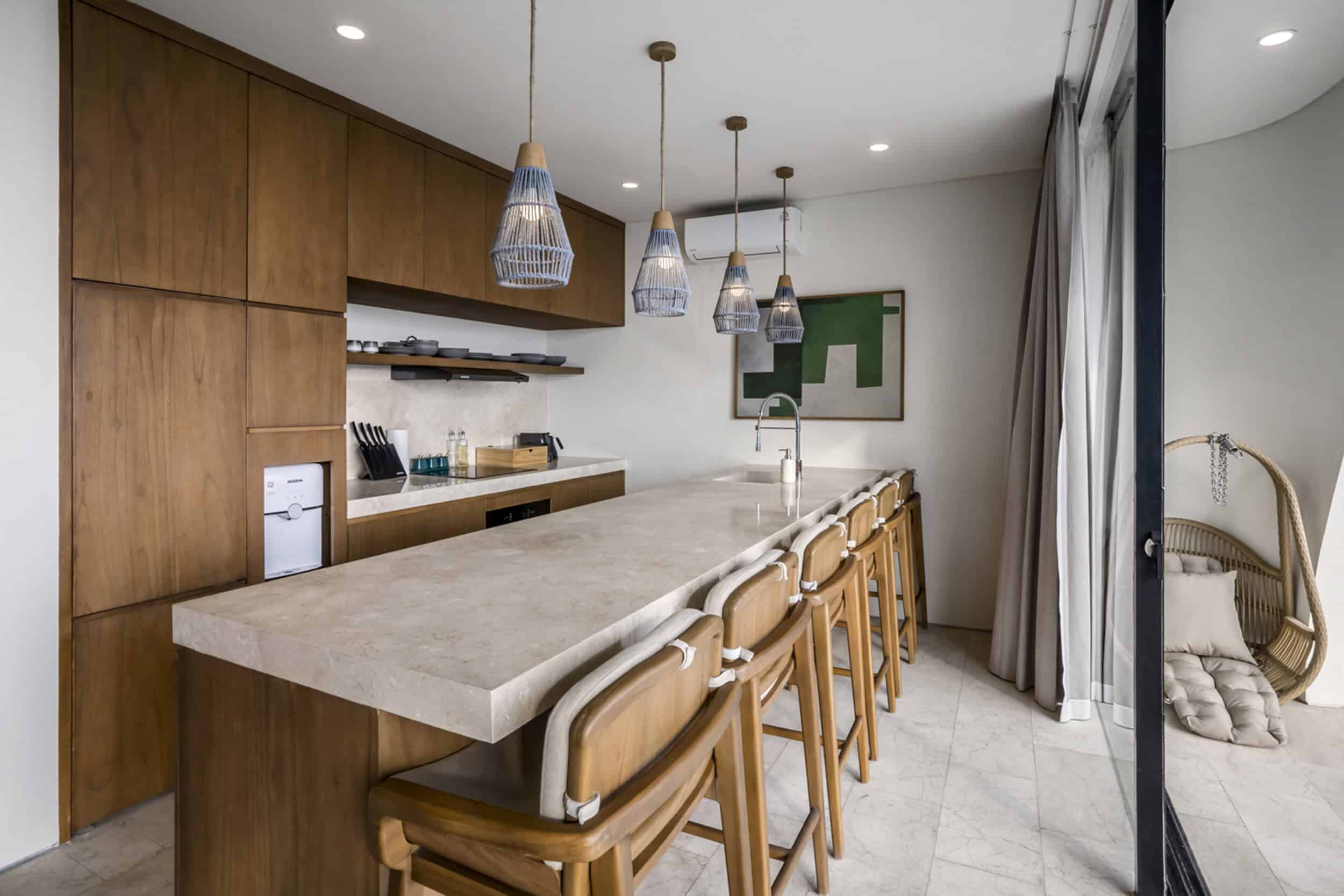 Fully equipped kitchen with kitchen island at a Uluwatu villa