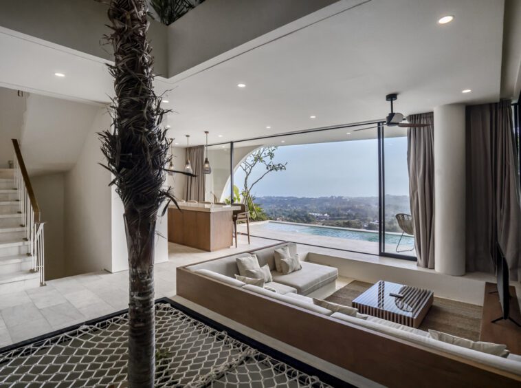 Living room of Uluwatu villa with palm tree in the centre